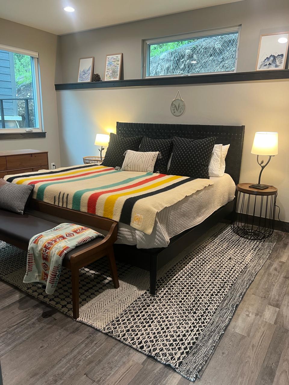Master bedroom with Pendleton blanket and mountain decor