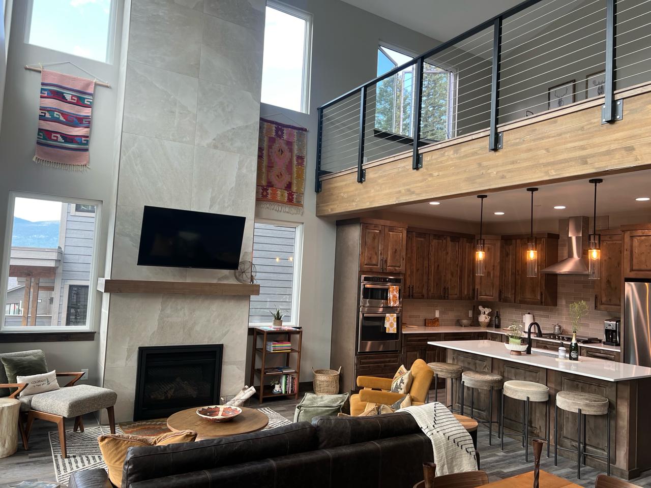 Living room with vaulted ceiling and loft