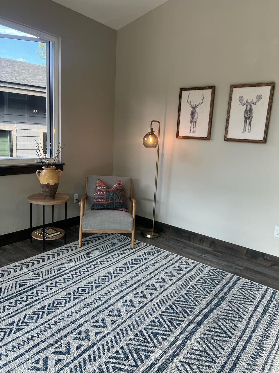 Upstairs sitting nook with chair and deer art