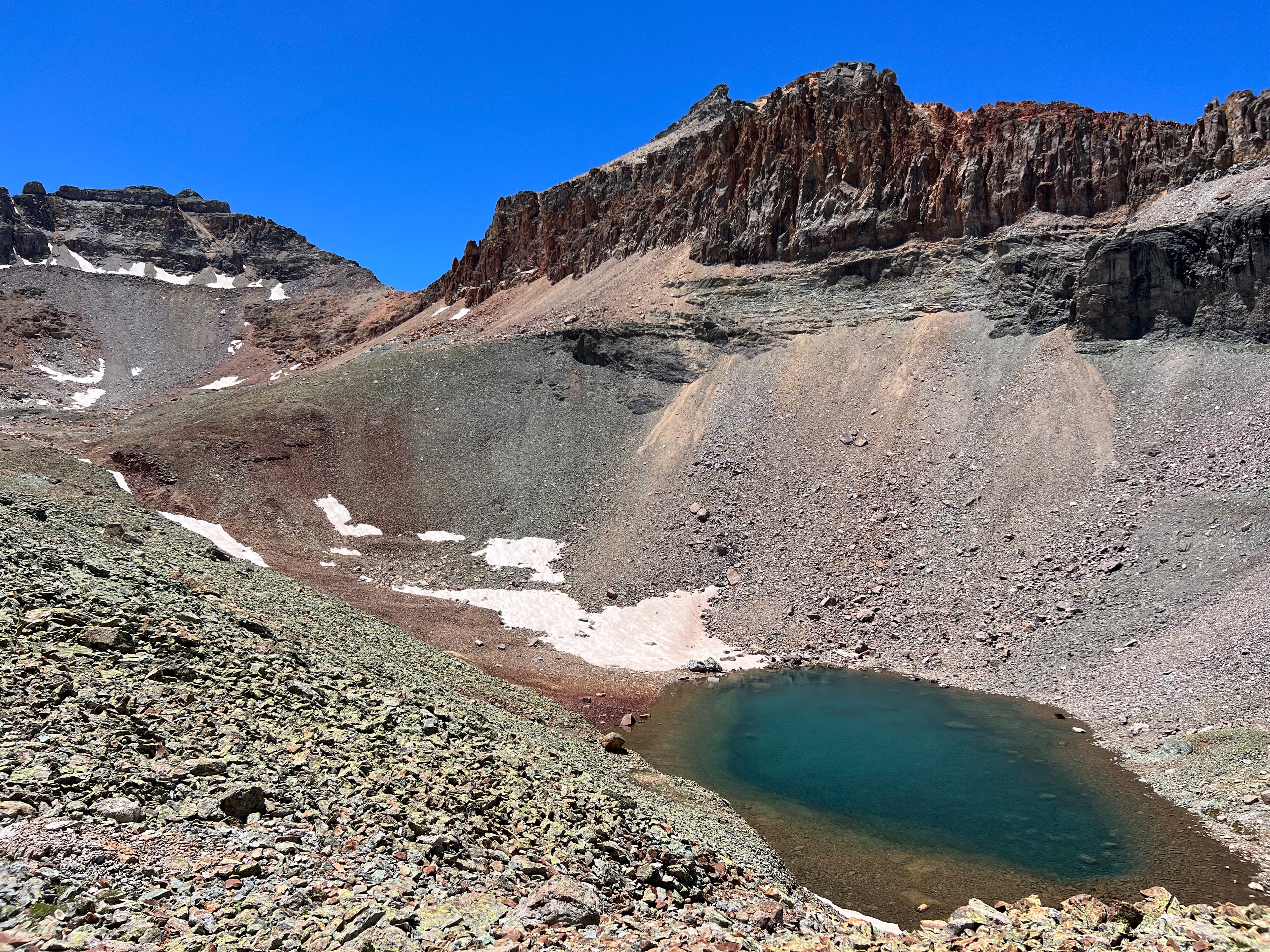 Upper Ice Lake beneath rocky ridgeline