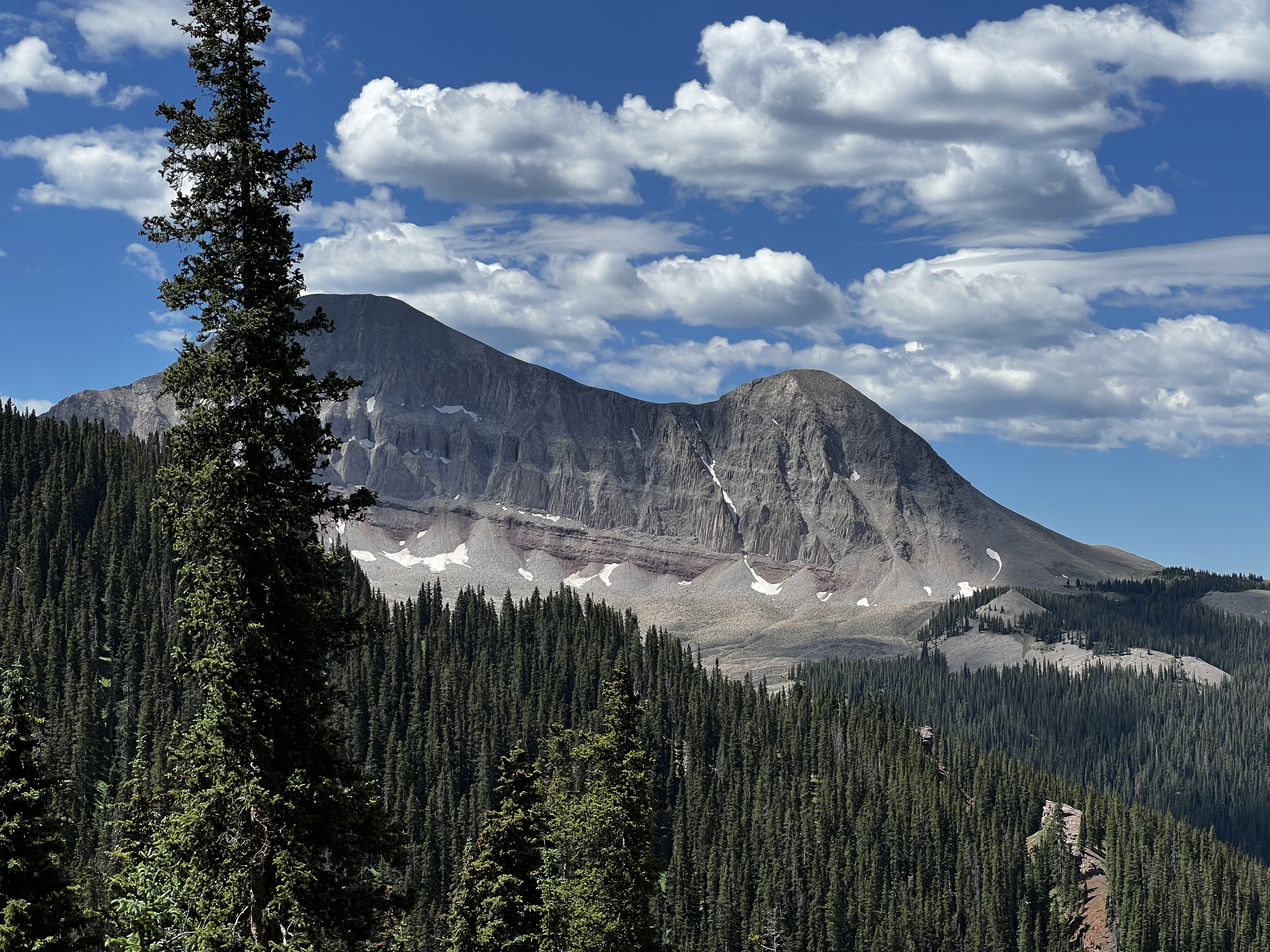 Snow-capped Engineer Mountain peak against blue sky