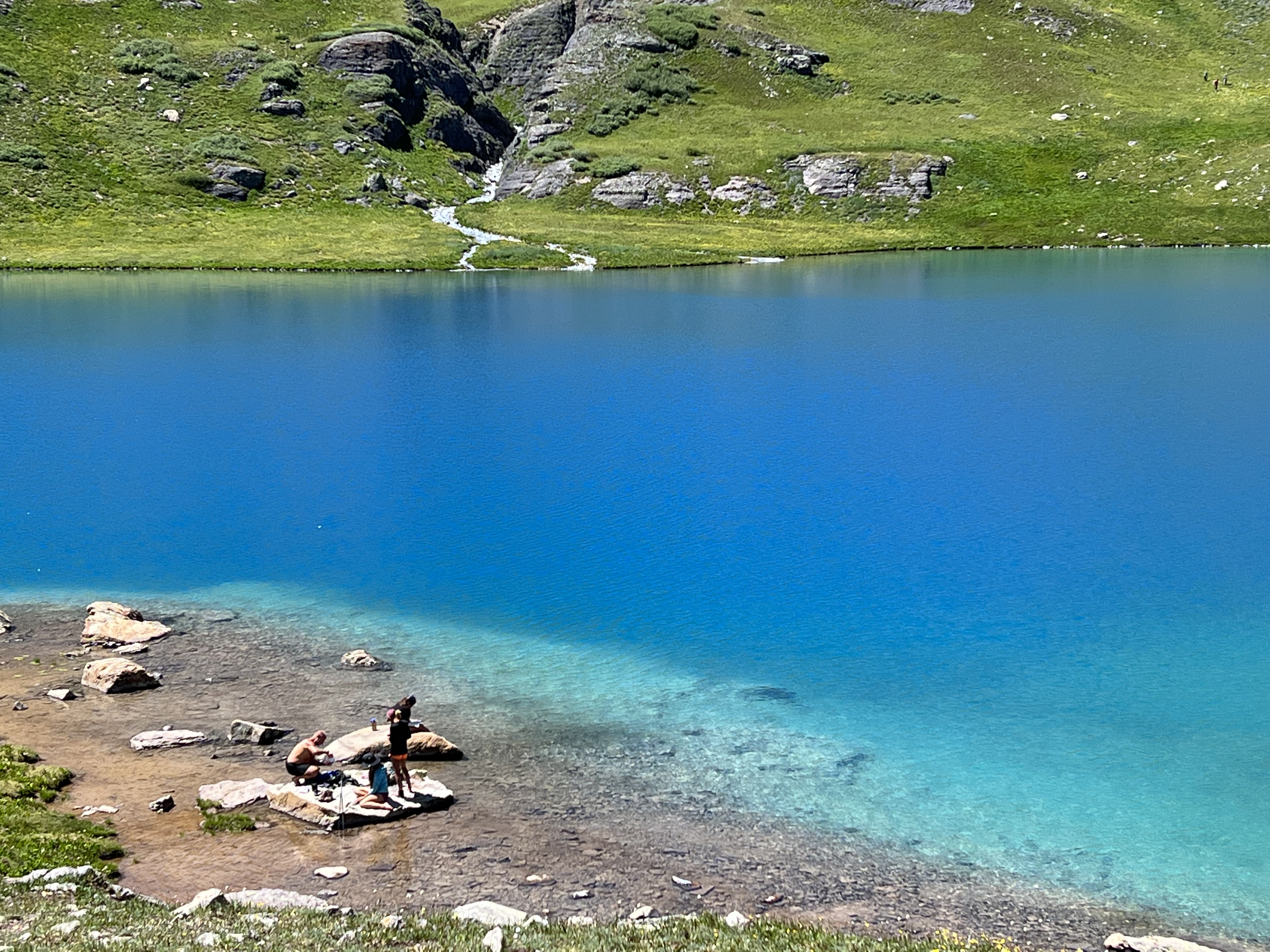 The turquoise of Ice Lake is almost electric — glacial rock flour scatters light in impossible wavelengths